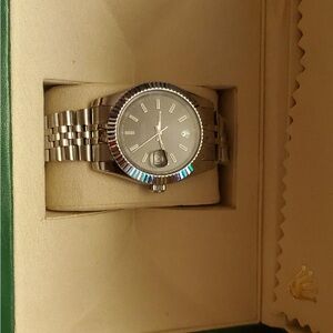 Rolex Silver Timepiece with Metallic Bracelet